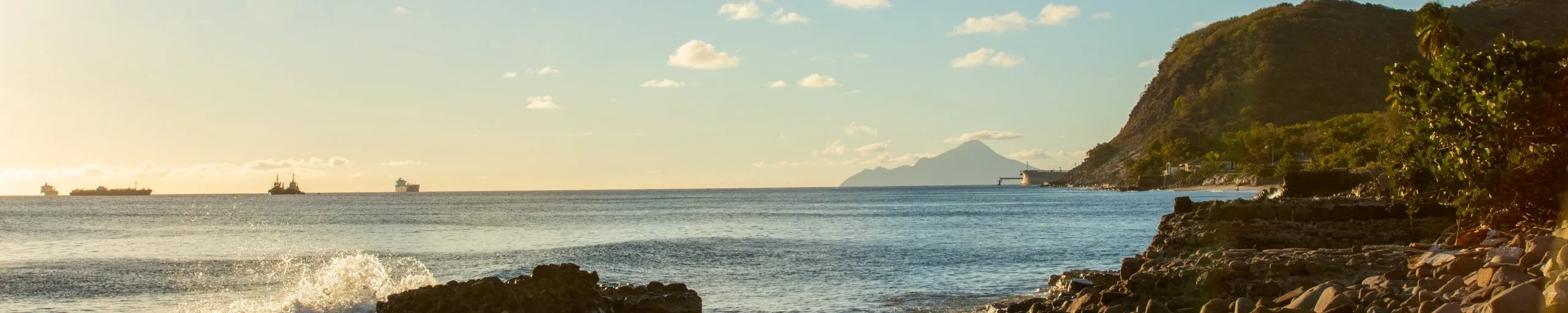 Statia's coastline seen from the water at sunset